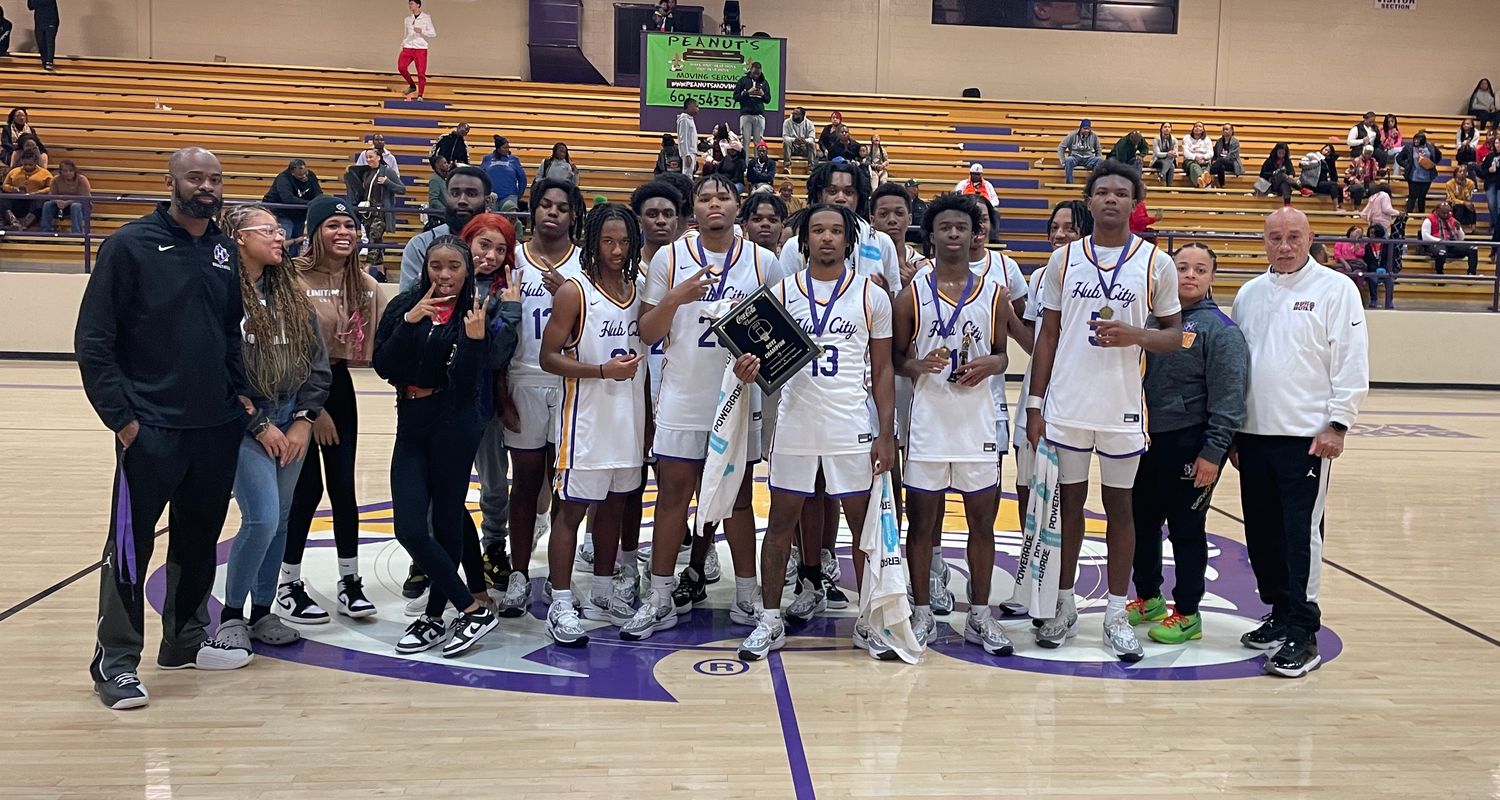 The Hattiesburg Tigers pose for a photo with the championship trophy after winning the Coca Cola Holiday Classic with a title-round win over the Brandon Bulldogs on Saturday, Dec. 30 at Hattiesburg High.